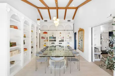 a dining room with a glass table and chairs at Malibu Park by Stay Awhile Villas in Malibu