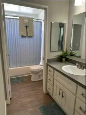 a bathroom with a sink and a toilet and a shower at 2-Bedroom Hollywood Apartment in Los Angeles