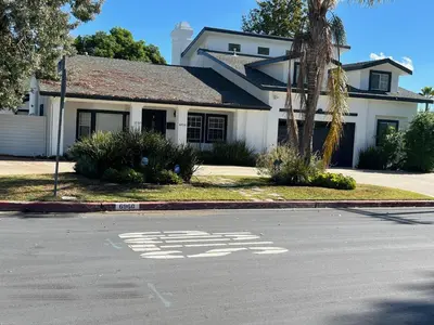 a white house with a stop sign on the street at Private gated 1bed & 1bath amazing for 2 in Los Angeles near Universal studio & Hollywood in Van Nuys Airport