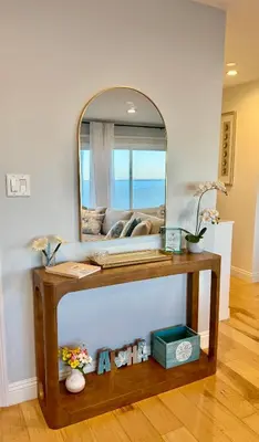 a table with a mirror on top of it at Sea La Vie Beachhouse on the sand in Long Beach