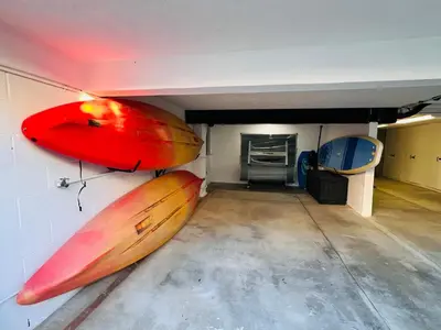 a room with two surfboards hanging on the wall at Sea La Vie Beachhouse on the sand in Long Beach