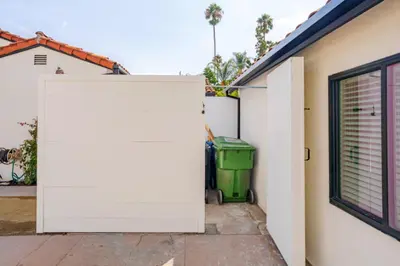 a white garage door in front of a house at Cute Guest Studio near Universal Studios sleeps 4 in Los Angeles