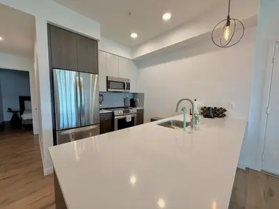 a kitchen with a white counter top and a sink at 3 Bedroom 2 Bath Westwood Condo in Los Angeles