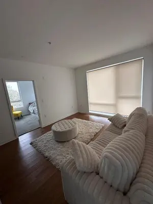 a living room with a couch and a rug at Modern Unit Near Glendale Galleria and Walk to Shopping & Dining! in Glendale