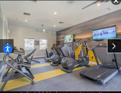 a gym with treadmills and cardio equipment in a building at The Chic Loft in Riverside