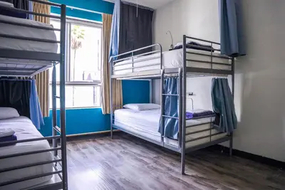 a room with two bunk beds and a window at Samesun Hollywood Hotel & Hostel in Los Angeles