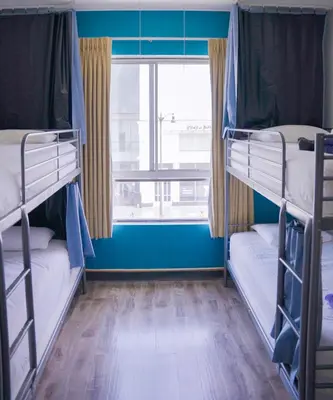 two bunk beds in a room with a window at Samesun Hollywood Hotel & Hostel in Los Angeles