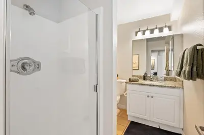 a bathroom with a sink and a toilet and a mirror at The Bleu Pearl 3Bed 2bath Venice Beach Santa Monica and Marina Del Rey in Los Angeles