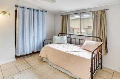 a bedroom with a bed and a window at Work, Play and Relax Home with Yard in Lancaster! in Lancaster