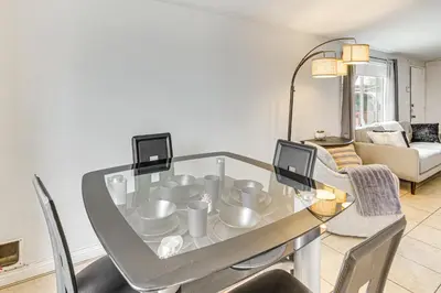 a dining room with a glass table and chairs at Work, Play and Relax Home with Yard in Lancaster! in Lancaster
