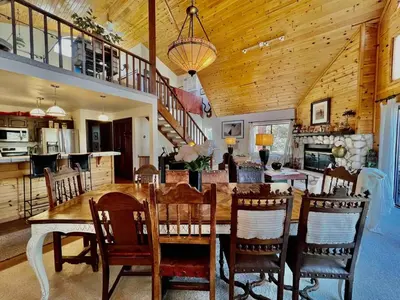 a kitchen and dining room with a table and chairs at ADELAIDE HILL IN PINE MOUNTAIN CLUB BREATHTAKING VIEWS 3Bd 3Bth SPA TUB in Pine Mountain Club