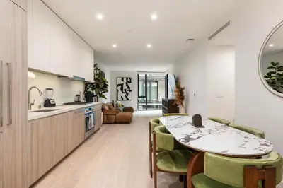 a kitchen and dining room with a table and chairs at Luxurious 2-Bedroom Retreat in Santa Monica in Los Angeles