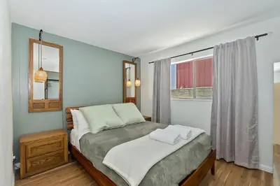 a bedroom with a bed and a window at Lake Gregory Skyline Ridge in Crestline
