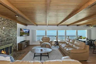 a living room with a couch and a fireplace at Lake Gregory Skyline Ridge in Crestline