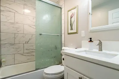 a bathroom with a shower and a sink and a toilet at Modern Oasis for Families & Business, Pets OK, EV in Orange