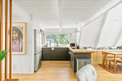 a kitchen with white walls and a white ceiling at Luxury A-Frame Retreat in Lake Arrowhead