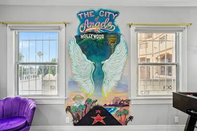 a mural of a mermaid on a wall at Foosball l LA Mural l DTLA l UnivStudios l BevHills in Glendale