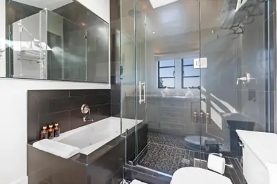 a bathroom with a tub and a toilet and a sink at Casa Cortona by Stay Awhile Villas in Los Angeles