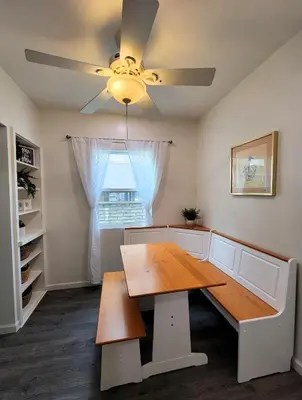 a dining room with a table and a ceiling fan at Perfectly located Pico Robertson ground floor 3 bedroom apartment Walk to restaurants WIFI TV Game Console Parking 5 minutes to Rodeo Drive in Los Angeles