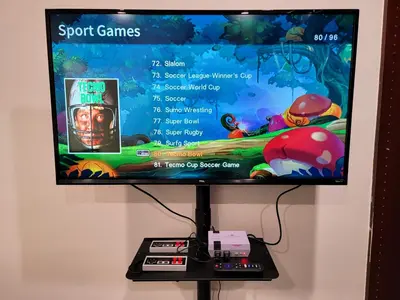 a flat screen tv sitting on top of a stand at Perfectly located Pico Robertson ground floor 3 bedroom apartment Walk to restaurants WIFI TV Game Console Parking 5 minutes to Rodeo Drive in Los Angeles
