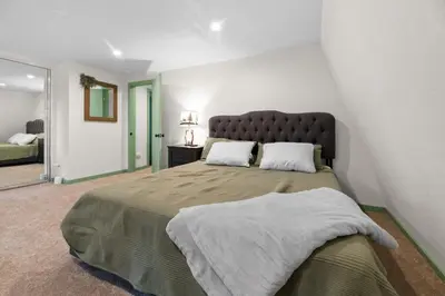a bedroom with a large bed in a room at Midnight Pines Cabin - Cozy Get-Away Near Slopes! in Big Bear Lake