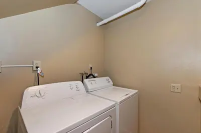a white washer and dryer in a laundry room at Big 10 Luxury Cabin/Walk to Snow Summit- HotTub in Big Bear Lake