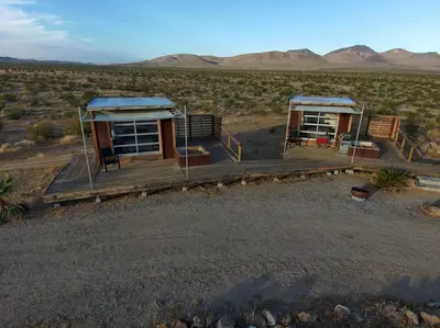 an aerial view of two huts in the desert at Secluded Glamping Eco-Pod Rental in the Mojave Desert near Ridgecrest, California in Ridgecrest