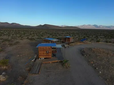 a small house in the middle of a desert at Secluded Glamping Eco-Pod Rental in the Mojave Desert near Ridgecrest, California in Ridgecrest