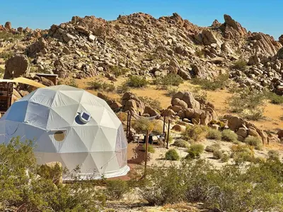 a tent in the middle of a desert with a mountain at Stunning Geo Dome with Joshua Tree vibes in Palmdale