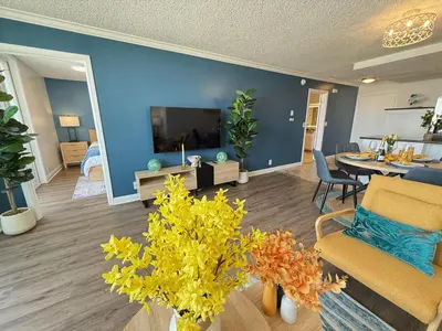 a living room with a couch and a dining room at Oceanfront Sanctuary 1 BR Beach Access 218 in Hermosa Beach