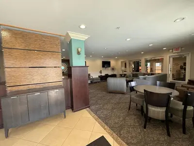 a lobby with a restaurant with a table and chairs at Oceanfront Sanctuary 1 BR Beach Access 218 in Hermosa Beach