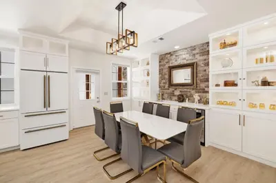 a dining room with a white table and chairs at Castlewood Retreat at Big Bear Central Modern Family Chalet in Big Bear Lake