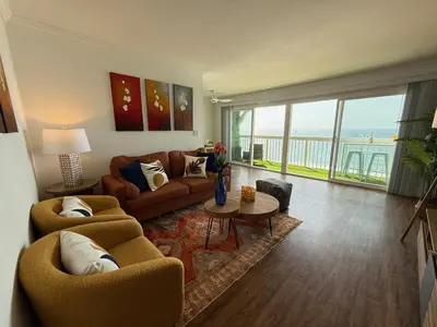 a living room with two couches and a view of the ocean at Oceanfront 1 Bed 1 Bath , Parking, Stunning View 337 in Redondo Beach