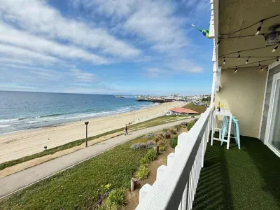 a view of the beach from the balcony of a house at Oceanfront 1 Bed 1 Bath , Parking, Stunning View 337 in Redondo Beach