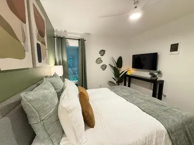 a bedroom with a white bed and a television at Oceanfront 1 Bed 1 Bath, Parking, Amazing View 132 in Redondo Beach