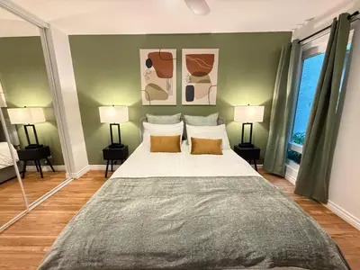 a bedroom with a large bed with two lamps at Oceanfront 1 Bed 1 Bath, Parking, Amazing View 132 in Redondo Beach