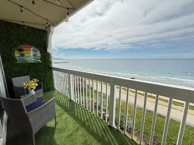 a balcony with a view of the beach at Oceanfront 1 Bed 1 Bath, Parking, Amazing View 132 in Redondo Beach