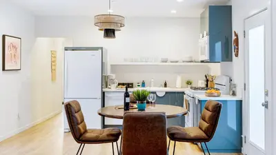 a kitchen with a table and chairs in a kitchen at 2 Units in Prime Hollywood Location Chic Renovated 1BDRs w Patio AvantStay in Los Angeles