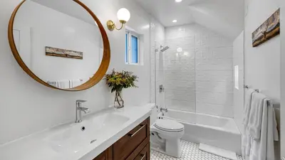 a bathroom with a sink and a toilet and a mirror at 2 Units in Prime Hollywood Location Chic Renovated 1BDRs w Patio AvantStay in Los Angeles
