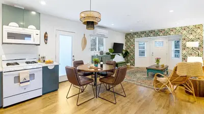 a kitchen and living room with a table and chairs at 2 Units in Prime Hollywood Location Chic Renovated 1BDRs w Patio AvantStay in Los Angeles