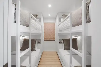 a room with white shelves with pillows at The Surf Lodge Villa in Malibu