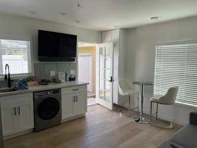 a kitchen with a sink and a dishwasher at Private guest cottage in Long Beach