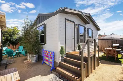 a tiny house with a staircase and a patio at Disney Beaches Close Fire Pit Stadiums in Norwalk
