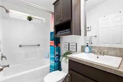 a bathroom with a sink and a toilet and a shower at Disney Beaches Close Fire Pit Stadiums in Norwalk