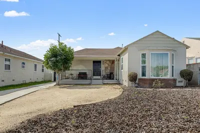 a house with a gravel driveway in front of it at Comfy Home Near Sofi Stadium 2 in Los Angeles