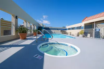a swimming pool on a balcony of a building at The Heart Of Hollywood Hills in Los Angeles