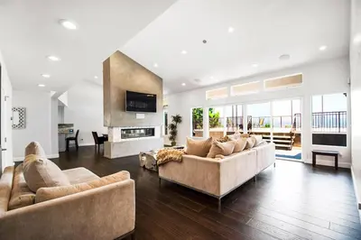 a large living room with two couches and a fireplace at House in the Hills in Los Angeles
