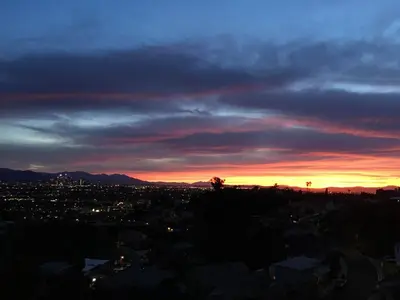 a view of a city at sunset at House in the Hills in Los Angeles