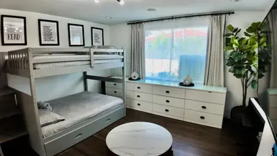a bedroom with two bunk beds and a window at House in the Hills in Los Angeles