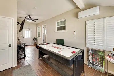 a living room with a pool table in it at 4 Mi to Dtwn Riverside Gem with Pool and Game Room in Riverside